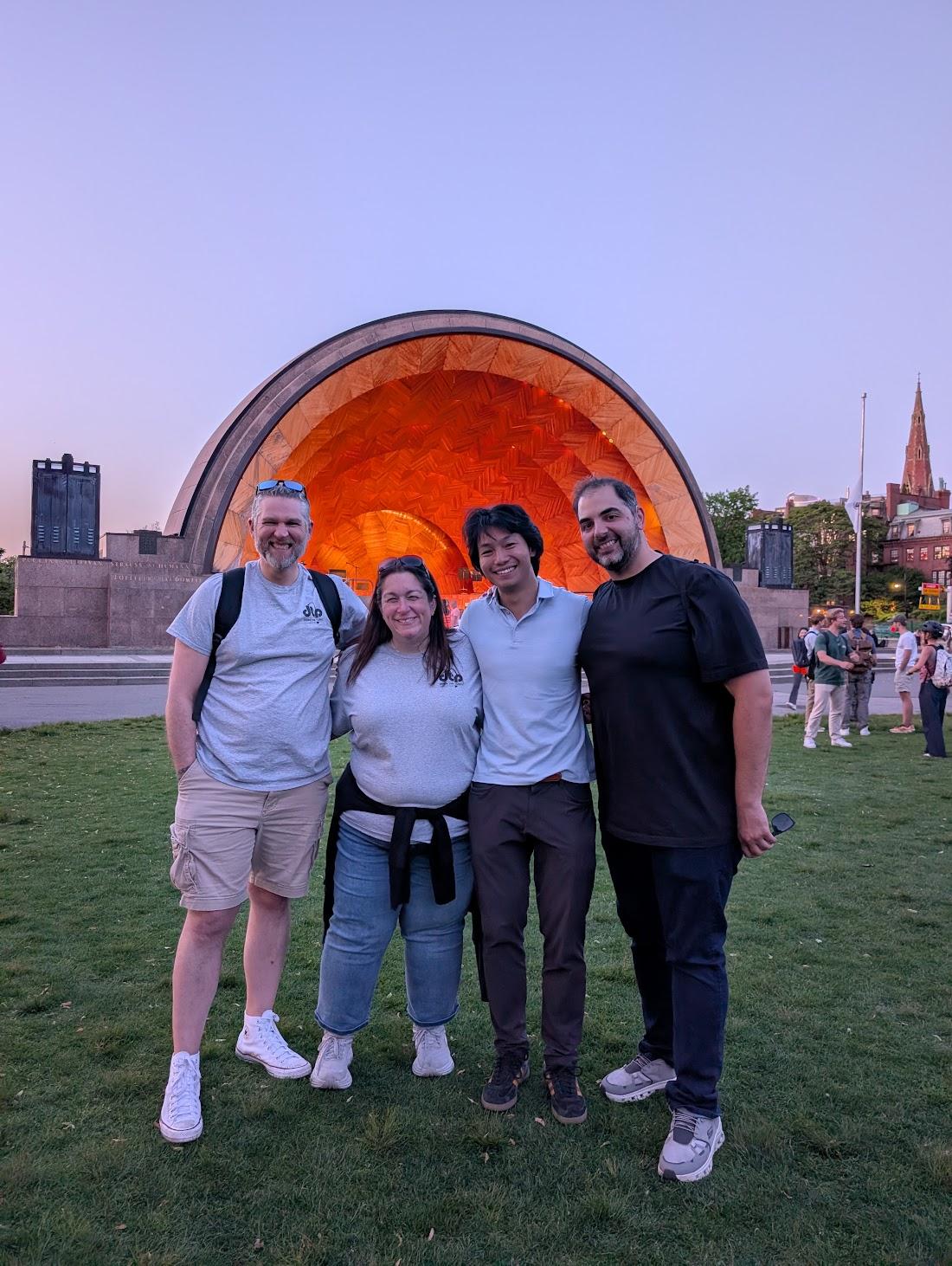 Tactus team members together in front of the Hatch Shell at a partner concert event
